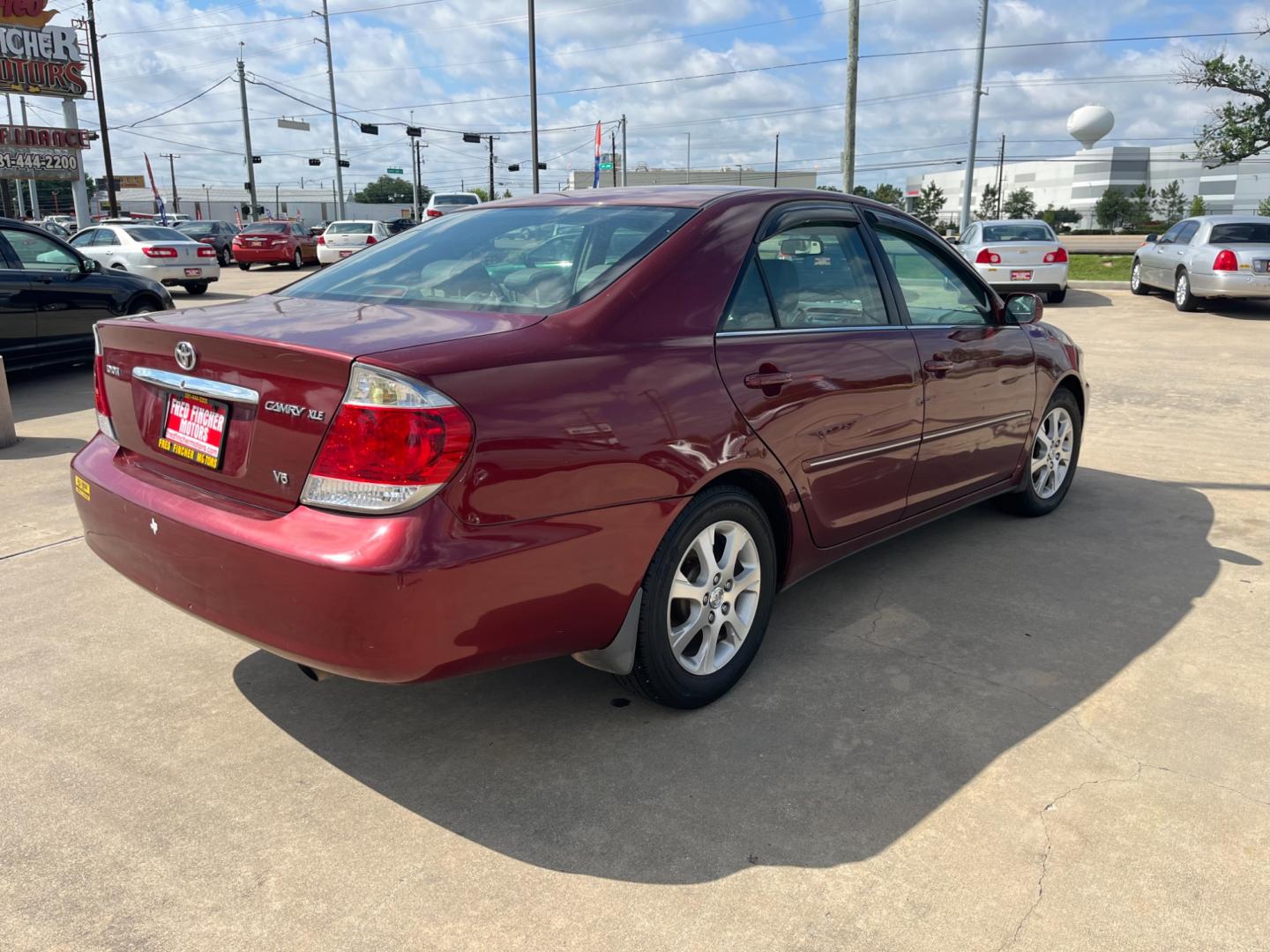 2006 red /TAN Toyota Camry LE V6 (4T1BF30KX6U) with an 3.0L V6 DOHC 24V engine, 5-Speed Automatic Overdrive transmission, located at 14700 Tomball Parkway 249, Houston, TX, 77086, (281) 444-2200, 29.928619, -95.504074 - Photo#6